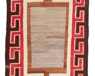 89
A Navajo Regional Rug
Circa 1920, Diné
Woven in red, dark brown, light brown, grey, and cream handspun wool with an open center, floating X elements, and a hooked border
63.5" H x 36" W
Estimate: $700 - $900