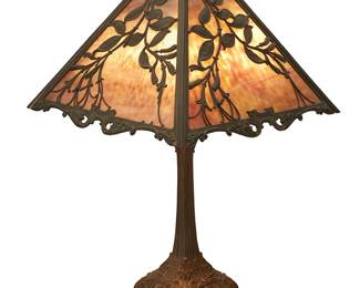 71
A Wilkinson Table Lamp Model 515
Early 20th century
Base marked in relief to underside: 515
The Art Nouveau three-light patinated bronze table lamp raised on four feet and surmounted by a later replaced lavender slag glass shade featuring foliate overlay, electrified
Overall: 24" H x 15" W x 15" D; Shade height: 8.5"
Estimate: $800 - $1,200