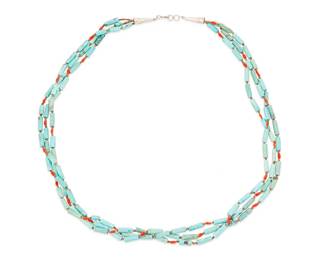 239
A Southwest-Style Turquoise And Coral Necklace
Mid/late 20th century
Appears unmarked
A delicate three-strand necklace with alternating turquoise cylinder beads and coral and shell beads and stamped silver cone terminals
27" L
Estimate: $200 - $400