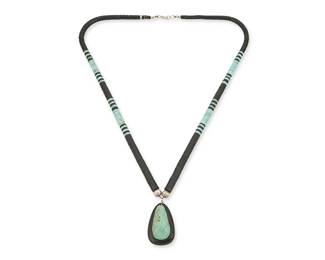 234
A Kewa/Santo Domingo Pueblo-Style Necklace
Mid/late 20th century
Appears unmarked
A single strand necklace with graduated turquoise and jet discs with a large turquoise and black jet teardrop pendant
31" L x 2.5" H
Estimate: $500 - $700