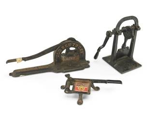 212
Three Cast Iron Tobacco Plug Cutters
Late 19th century
One marked in the casting: "Old Kentucky" / "Burr Oak" / Harry Weisinger Tobacco Co. / Louisville, NY; another marked: Wilson & McCallay Tobacco Co. / Middletown Ohio; another marked: Good Chew / coolest smoke ever put in a pipe / 16031
Comprising three variations of countertop tobacco plug cutters, 3 pieces
Largest: 6.875" H x 19" W x 4.625" D; Smallest: 3.25" H x 12" W x 6.25" D
Estimate: $400 - $600