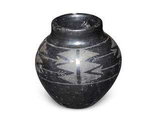 151
Lorencita Naranjo Tafoya (1899-1987)
A blackware pottery jar, early/mid-20th century
Incised to underside: Lorencita Naranjo / Santa Clara Pueblo
The jar with black arrow motif on black buff glaze
5.375" H x 5.25" Dia.
Estimate: $200 - $400
