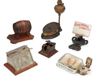 209
A Group Of Tobacco Paraphernalia
Late 19th/early 20th century
One marked: King Oscar / Always Good; another marked: Boston Trade; another marked: Acker Merrall & Condit Co's Imported, Key West and Domestic Cigars Sold Here; another marked: Grauley's Golden Rule / H.B. Grauley Maker Phila.; another marked: Banghart Bros. / Fine Cigars / Chicago Ills.
Comprising six cigar cutters, one with attached rolling tray, one including a lamp lighter, 6 pieces
Largest: 12.5" H x 10" W x 5.5" D; Smallest: 4.125" H x 4.375" W x 5" D
Estimate: $400 - $600