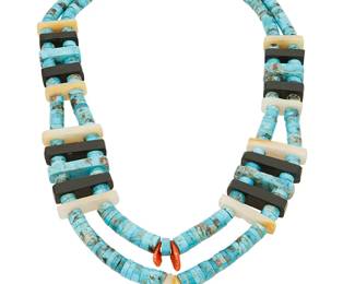 233
A Kewa/Santo Domingo-Style Turquoise Necklace
Mid/late 20th century
Clasp stamped: A. Ring / 925S
A double strand of tapering rolled turquoise beads spaced with jet, mother-of-pearl and finished with coral and mother-of-pearl drops, with associated sterling silver clasp, likely Danish
25.25 " L x 3" H
351.6 grams gross
Estimate: $400 - $600