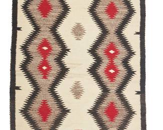 99
A Navajo Regional Rug
Mid-20th century, Diné
With two columns of conjoined serrated diamonds and floating interior elements woven in cream, red, black/dark brown, and grey wool
60.5" H x 41.5" W
Estimate: $300 - $500
