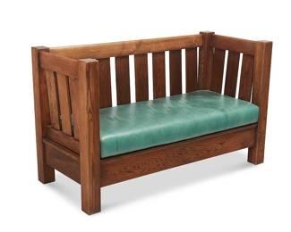 188
A Stickley-Style Arts & Crafts Settle
Early 20th century
Unmarked
The two-to-three-seater box settle with four posts and slatted arms and back above a box rail apron, featuring an emerald leather seat cushion
36.25" H x 60" W x 26.5" D
Estimate: $700 - $900