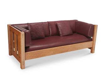 94
A Stickley "Mission Settle," No. 89-208
2004; Manlius, NY
With piecrust Stickley burn mark and metal tag bearing the shop mark [joiner's compass]; dated and marked: #35; further marked: 89-208
The wood settle from Stickley's nostalgic "Mission" collection, based on Gustav Stickley's 1902 design, with four posts and mortis and tenon construction and slatted arms and back, all joined by a box rail, featuring "Blackberry" leather upholstered cushions and two throw pillows
29.75" H x 77.5" W x 33.75" D
Estimate: $700 - $900