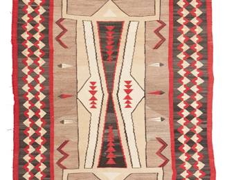 131
A Navajo Pictorial Textile
Early 20th century, Diné
Woven in red, light brown, grey, black, cream, and beige wool with a central conjoined figural motif, feathers, and a complex diamond banded border
75.5" H x 44" W
Estimate: $3,000 - $5,000
