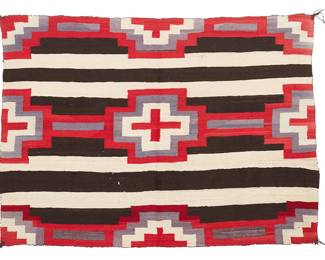 76
A Navajo Third Phase Chief's Blanket
Late 19th century, Diné
Woven in alternating bands of dark brown/black and natural cream wool with red and purple banding and crosses
41.5" H x 57" W
Estimate: $2,000 - $3,000