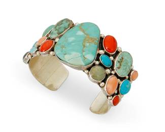 266
A Gilbert Secatero Navajo Cluster Set Cuff Bracelet
Gilbert Secatero (b. 20th century, Diné)
Late 20th century
Stamped: Gilbert Secatero [along teepee icon] / Sterling
A sterling silver multi-stone cluster bracelet with central set turquoise
6.75" total inner C x 1.625" H, with a 1.125" gap
85.8 grams gross
Estimate: $500 - $700