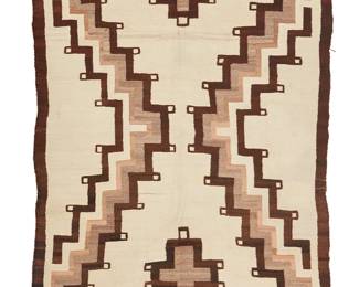 100
A Navajo Regional Rug
Early 20th century, Diné
Woven in cream, grey, and dark brown wool with a central X motif
80" H x 60" W
Estimate: $800 - $1,200