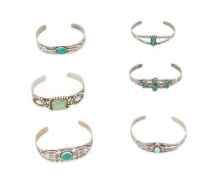 270
A Group Of Southwest Silver And Stone Set Cuff Bracelets
Mid-20th century
Four marked for sterling; one further stamped: Maisels
Comprising six sterling silver narrow cuff bracelets, each with set turquoise and with various stamped overlay motifs including thunderbirds and arrowheads, 6 pieces
Largest: 6.625" inner C x 0.75" H, with a 1" gap; Smallest: 6" inner C x 0.625" H, with a 1.125" gap
109.6 grams gross
Estimate: $500 - $700