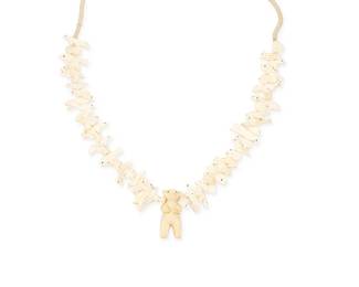 250
A Zuni Pueblo-Style Carved Bone Fetish Necklace
Mid/late 20th century; Southwestern United States
Appears unmarked
A single strand Quandelacy-style necklace with a variety of carved bone animals and a larger resin-like standing bear figure to center, with a traditional wrapped neck cord
31" L x 2" H
Estimate: $200 - $300