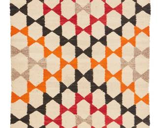 129
A Navajo Regional Rug
Mid-20th century, Diné
Woven in cream, red, black, orange, and grey-brown wool in an allover geometric star pattern with banded ends
56" H x 32.5" W
Estimate: $200 - $400