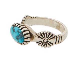 263
A Fannie Bitsoi-Russell Navajo Sterling Silver Ring
Fannie Bitsoi-Russell and Phil Russell Sr. (b. 1953 & b. 20th century, Diné)
Late 20th/21st century
Stamped: Bitsoi-Russell
A delicate sterling silver ring with incised bezel set cabochon turquoise and incised "concho" motifs to shoulders
Ring size: 8
6.9 grams gross
Estimate: $300 - $500