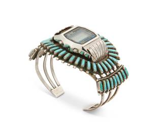 264
A Southwest Zuni Pueblo-Style Petit Point Watch Cuff Bracelet
Mid/late 20th century
Appears unmarked
A three-wire silver cuff with row-set needlepoint turquoise and a central replaceable timepiece setting
6.625" total inner C x 1.875" H, with a 1" gap
59.3 grams gross
Estimate: $300 - $500
