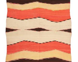 79
A Navajo Transitional Blanket
Late 19th century, Diné
Woven in red, yellow, cream, dark brown, and green wool with serrated banding and a central band of elongated diamonds
71.5" H x 49" W
Estimate: $1,000 - $1,500