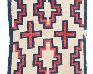 81
A Navajo Transitional Weaving
Circa 1900, Diné
Woven in natural cream, red, and blue handspun wool with floating stepped diamonds and crosses, with areas of lazy lines
58.75" H x 44.25" W
Estimate: $1,000 - $1,500