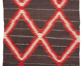 74
A Large Navajo Moki Weaving
Late 19th/early 20th century, Diné
Woven in red, purple, black, and cream wool with a serrated conjoined zigzag diamond motif floating over a thinly banded field of purple and black
103" H x 70" W
Estimate: $2,500 - $3,500