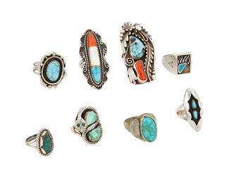 277
A Group Of Southwest Silver And Stone Set Rings
Eight works:

Johnson Largo (b. 20th century, Diné)
Mid-20th century
Stamped: JL [conjoined]
A large Navajo sterling silver ring with set turquoise and coral and elaborate silver overlay motifs
Ring size: 7.5; 2.125" H

A group of Southwest silver and stone set rings
Mid/late 20th century
Four unmarked; one stamped: P; one stamped G; one with etched marks: EJ 76
Seven rings in various styles including shadowbox, stone inlay, an Effie Calavaza-style Zuni snake motif and a bearpaw motif, each with set stones including turquoise and coral, 7 pieces
Largest: ring size: 11; Smallest: ring size: 4.5

8 pieces total
71.6 grams gross
Estimate: $400 - $600
