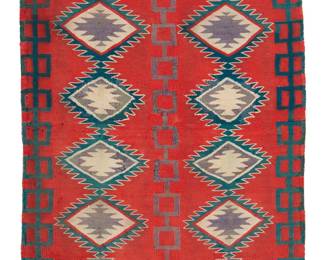 83
A Germantown Saddle Blanket
Late 19th century, Diné
With two columns of stacked and serrated diamonds and chains to border, woven in red, green, cream, and purple wool
42.25" H x 23" W
Estimate: $400 - $600