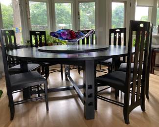Charles Rennie Mackintosh design by Cassina Furniture of Italy. 6ft. Round table with drop down lazy susan and 8 chairs.