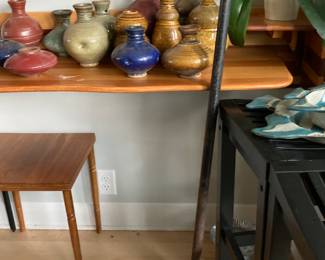 Garden art pottery stacks on metal pole