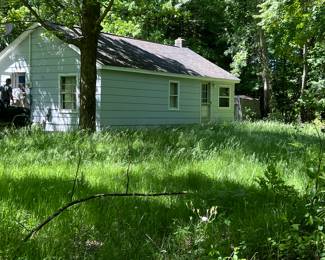 House on adjacent property needs to be moved - make offer to purchase/move