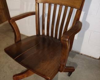 Vintage wood office chair on wheels