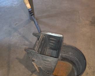 Metal wringer bucket on wheels