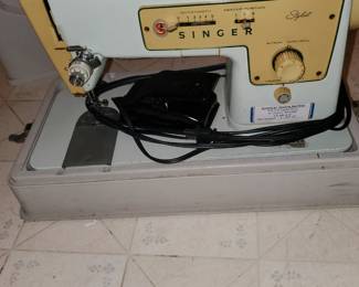 Vintage well-made metal Singer portable sewing machine.