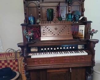 This Antique restored upright organ is a player type and plays itself