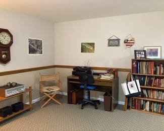 Vintage Clock, Vintage Realistic Stereo Receiver, Desk , Office Chair, Books , Bookcase, Directors Chair 