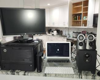 home office equipment: printer, Apple laptop, monitor, speakers...