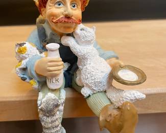  Seated Figurine With Milk and Cats