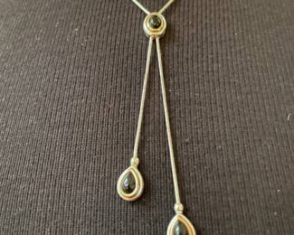  Silver Necklace where Each Chain Ends In A Teardopshaped Pendant