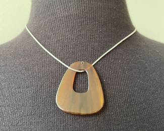  Simple Necklace with Smooth, Rounded Triangular Ambercolored Pendant