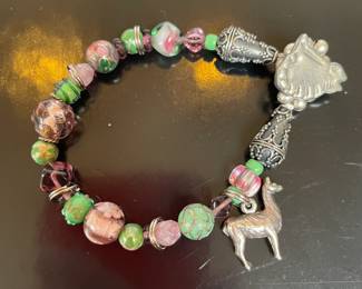 Green, Pink and Purple Beaded Bracelet featuring a prominent Llama Charm