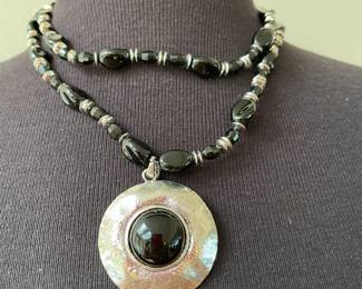 Two Stranded Black Beaded and Silver Spacer Necklace with Silvertone Circular Pendant with Black Stone