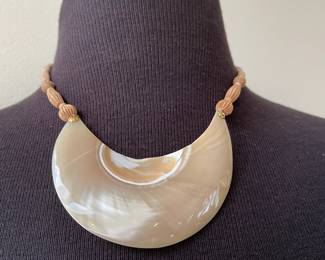 Beige Colored Necklace with Beige Glossy Swirled Crescentshaped Pendant