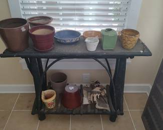 Painted twig garden porch table with shelf showing a selection of pots