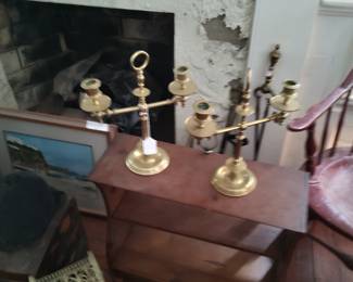 Paired candelabrum, 19th century, British, sitting on a late 19th century bobbin turned American cherry side table