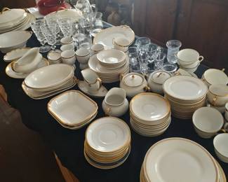Huge lot of principally French Haviland label made and Old French porcelain dining and serving dishes with gold banded border, late 19th century and early 20th century