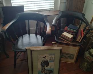 Set of four Japanese woodblocks from the 19th century in mat and framed arranged with a pair of black painted captains chairs 