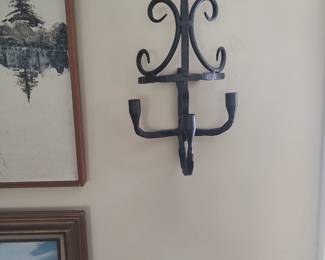 One of three handmade wrought iron wall sconces of an early 19th century or earlier design