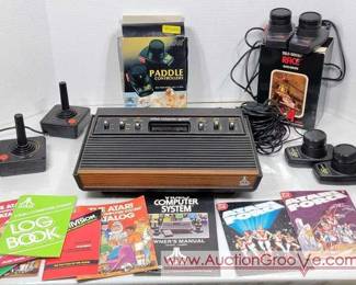8 Atari 2600 Gaming System with 4 Sets of Controllers, manuals and DC Comics