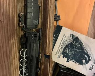 Gilbert American Flyer Locomotive.  These are the only two cars available long with some track and controller.