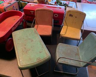 The cutest doll size metal table and chairs there are four chairs 