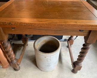 Staff favorite solid oak table with barely twist legs. Similar in size to a small library table 