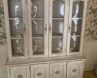 Beautiful farmhouse style china hutch 
The glass is curved in each section
